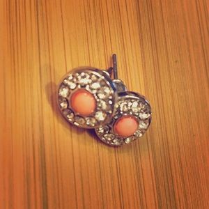 Small silver and pink studs.